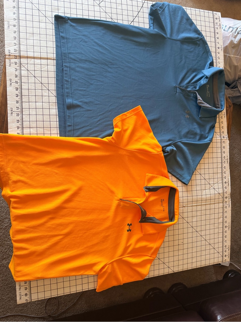 Lot of two Under Armour Men’s Performance Polos. Orange and Blue/Green